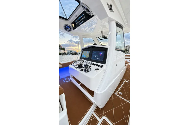 Slide: The Image of 2008 Grady-White Express 330 helm with modern navigation system and luxurious interior. - 33