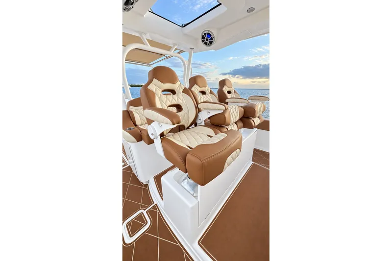 Slide: The Image of Luxurious seating on 2008 Grady-White Express 330 boat, featuring elegant brown and cream upholstery. - 29