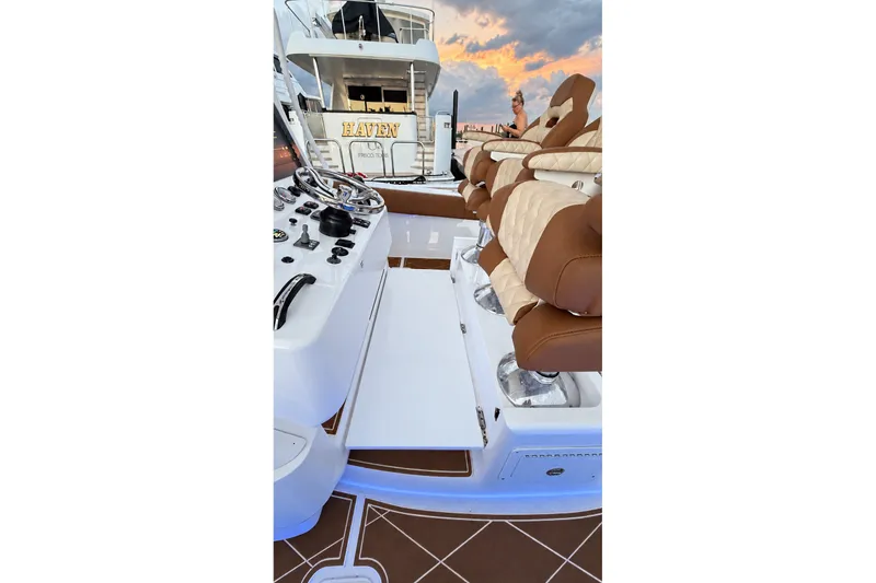 Slide: The Image of 2008 Grady-White Express 330 boat interior with luxurious seating and control panel. - 32