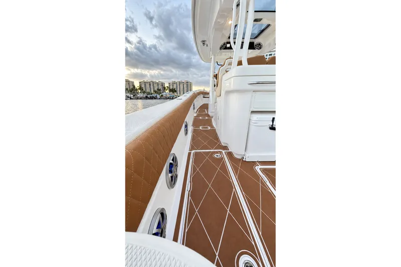 Slide: The Image of 2008 Grady-White Express 330 boat interior with brown cushioned seating and sleek design. - 41