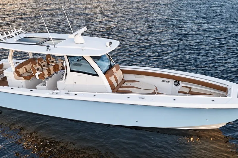 Slide: The Image of 2008 Grady-White Express 330 boat on water, featuring sleek design and spacious seating. - 11