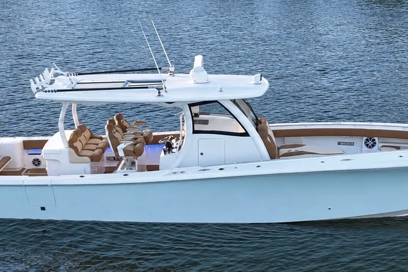 Slide: The Image of 2008 Grady-White Express 330 boat on water, featuring sleek design and spacious seating. - 3