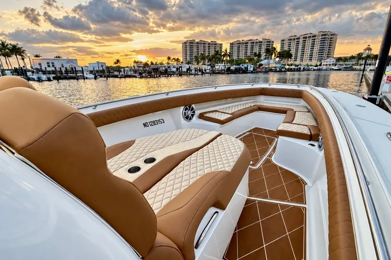 Slide: The Image of Luxurious 2008 Grady-White Express 330 boat interior at sunset, featuring elegant seating. - 43