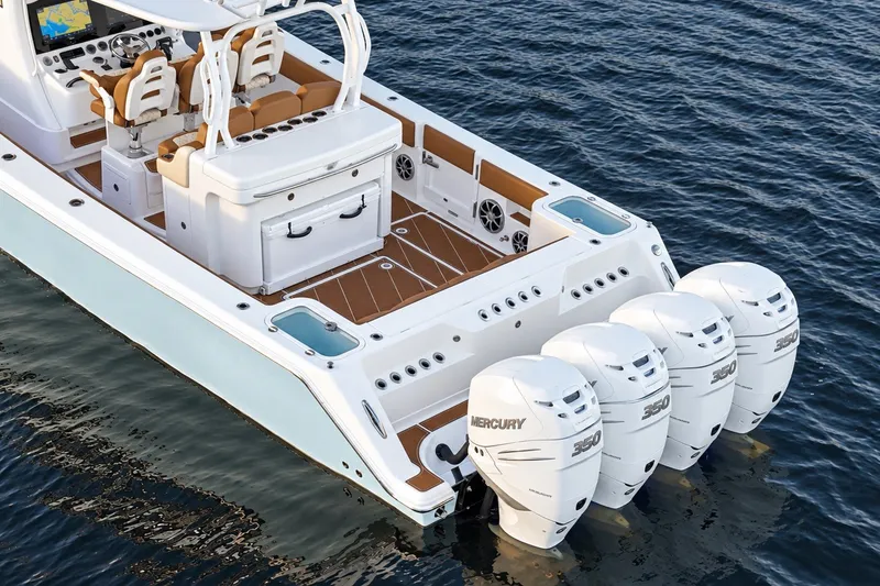 Slide: The Image of 2008 Grady-White Express 330 boat with four Mercury 350 engines on the water. - 16