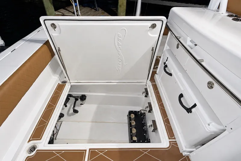 Slide: The Image of Open storage compartment on 2008 Grady-White Express 330 boat deck. - 27