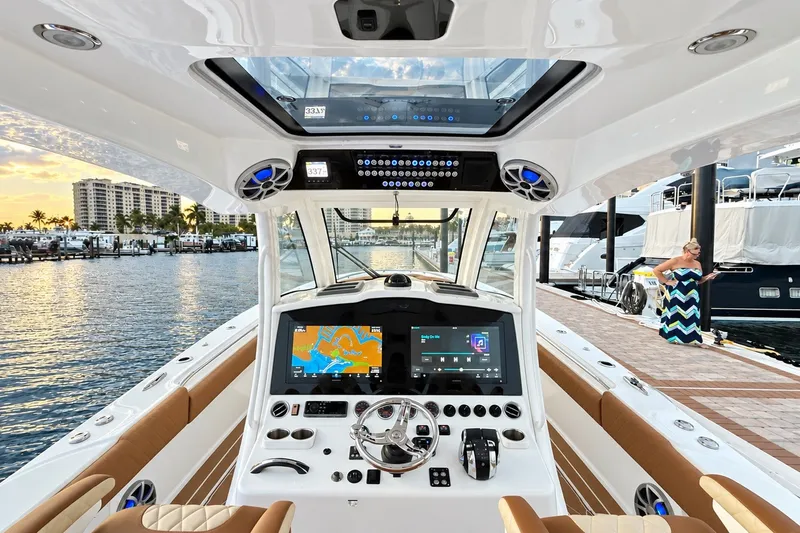 Slide: The Image of 2008 Grady-White Express 330 boat interior with modern navigation system at marina. - 34