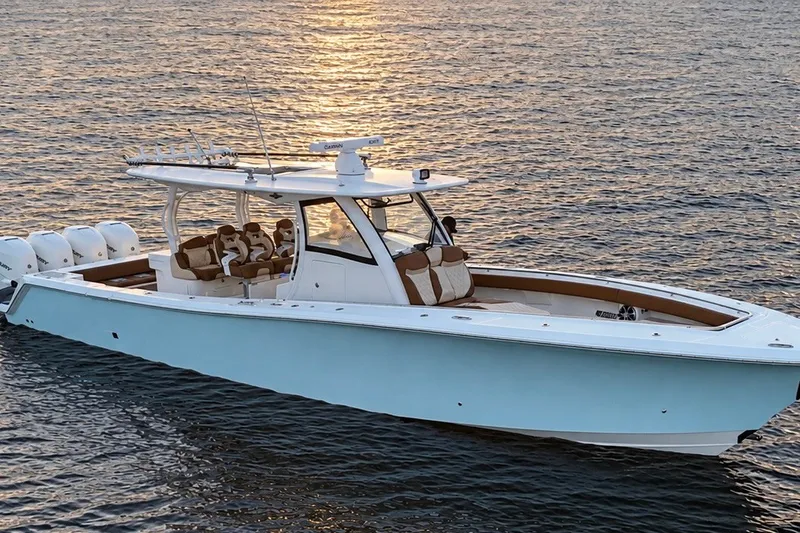 Slide: The Image of 2008 Grady-White Express 330 boat on calm water at sunset. - 4