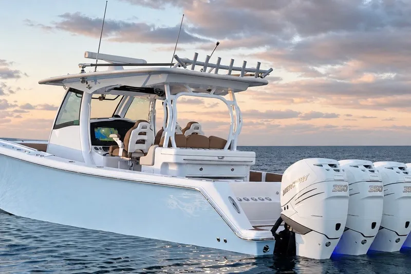 Slide: The Image of 2008 Grady-White Express 330 boat with triple Mercury 350 engines on open water. - 1