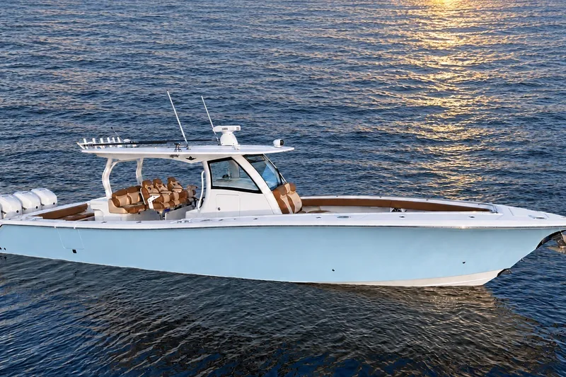 Slide: The Image of 2008 Grady-White Express 330 boat on calm water at sunset. - 5