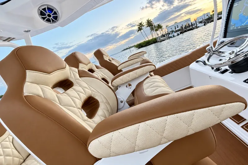 Slide: The Image of Luxurious seating on 2008 Grady-White Express 330 boat at sunset by the water. - 57