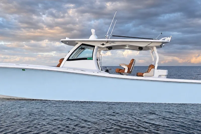 Slide: The Image of 2008 Grady-White Express 330 boat on calm ocean under cloudy sky. - 2