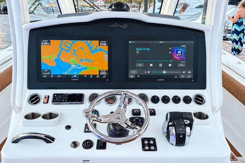 Slide: The Image of Helm of 2008 Grady-White Express 330 with Garmin navigation and control systems. - 35