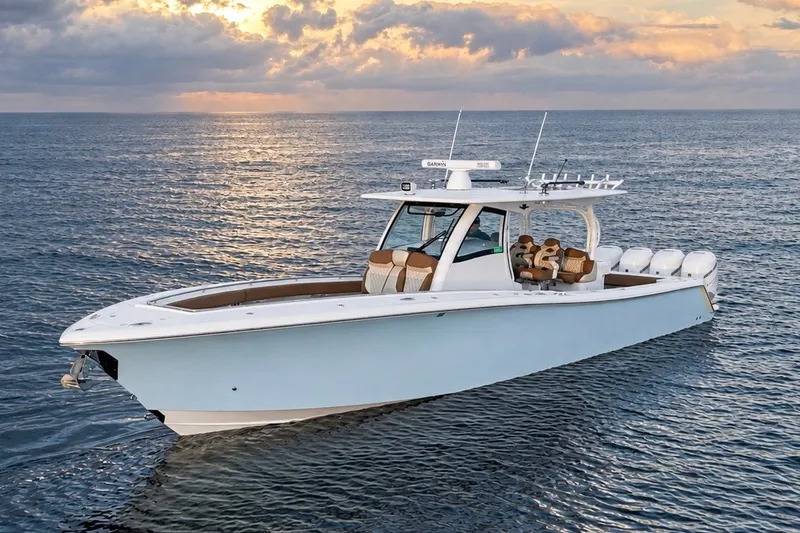 Slide: The Image of 2008 Grady-White Express 330 boat on calm ocean at sunset. - 22