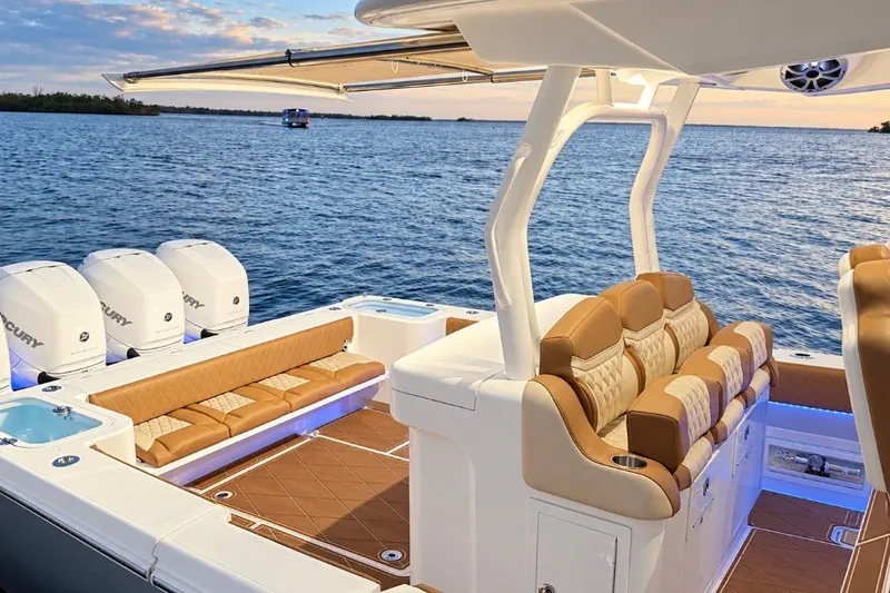 Slide: The Image of 2008 Grady-White Express 330 boat interior with luxurious seating and multiple outboard engines. - 50