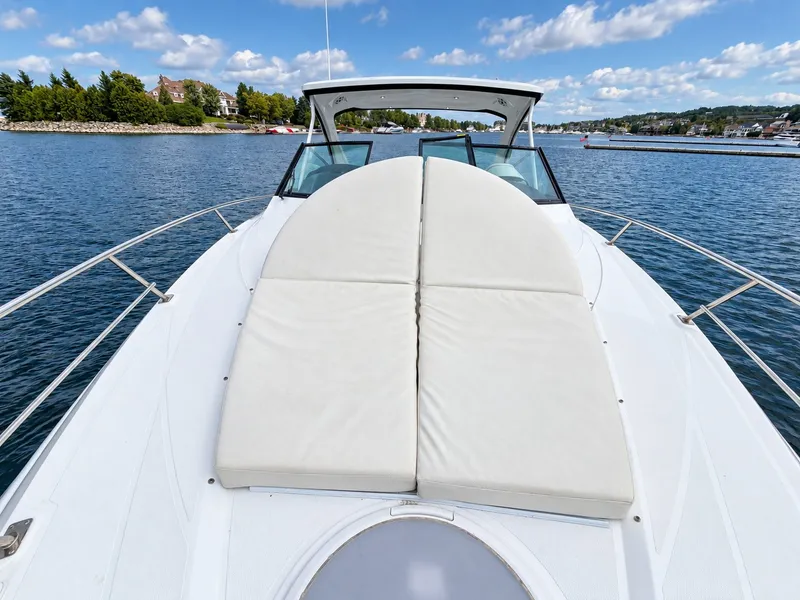 Slide: The Image of The image shows the foredeck of a 2020 Cruisers Yachts 35 Express with comfortable sun pads. - 33