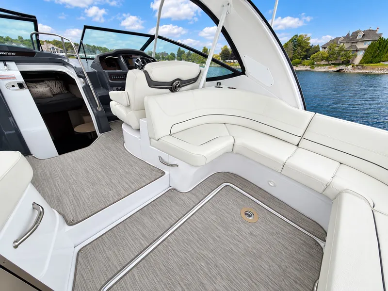 Slide: The Image of The image shows the cockpit of a 2020 Cruisers Yachts 35 Express with sleek white seating. - 23