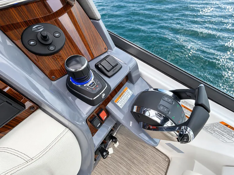 Slide: The Image of The image shows the helm of a 2020 Cruisers Yachts 35 Express with modern controls. - 31
