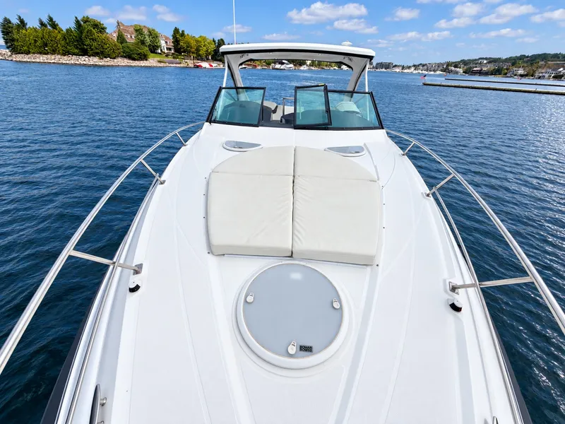 Slide: The Image of The 2020 Cruisers Yachts 35 Express on calm water with a spacious foredeck. - 32