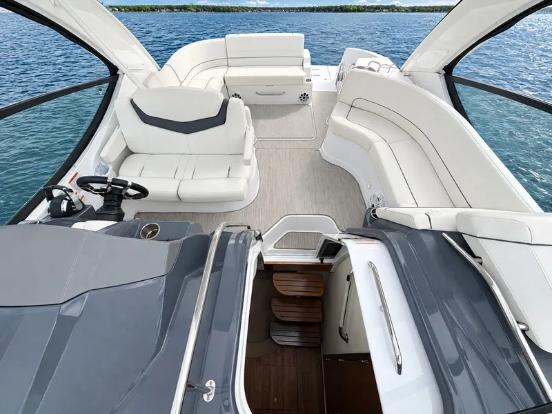 Slide: The Image of The image shows the cockpit of a 2020 Cruisers Yachts 35 Express with white seating and a helm station. - 36