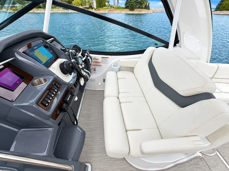 Slide: The Image of The cockpit of a 2020 Cruisers Yachts 35 Express with comfortable seating and modern electronics. - 28