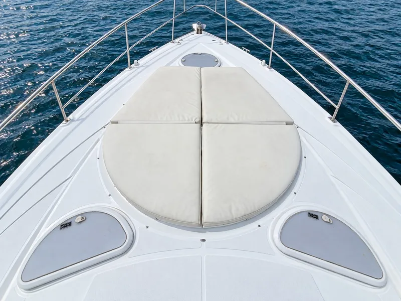Slide: The Image of The foredeck of a 2020 Cruisers Yachts 35 Express with beige sun pad. - 35