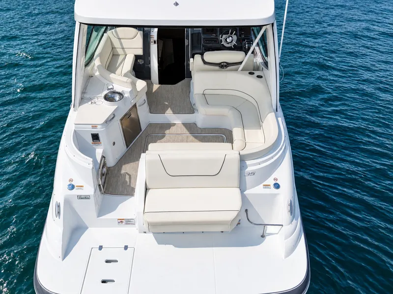 Slide: The Image of The image shows a luxurious yacht with a spacious cockpit and elegant white seating. - 18