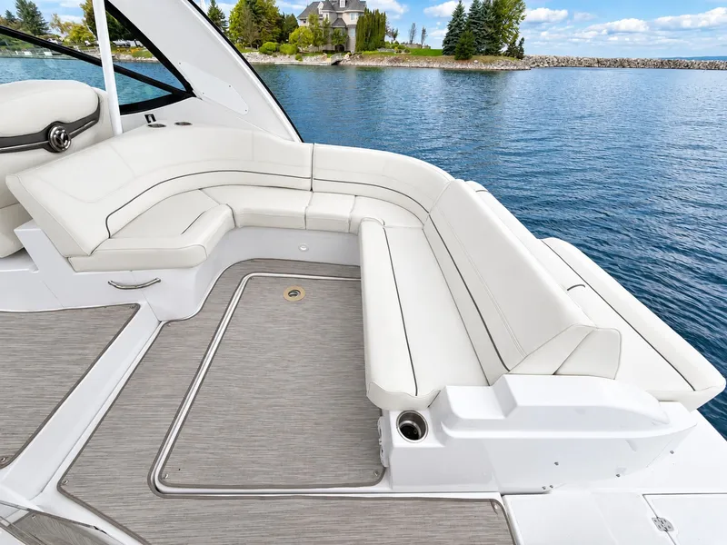 Slide: The Image of The image shows the cockpit of a 2020 Cruisers Yachts 35 Express with white cushioned seating. - 20