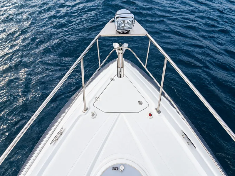 Slide: The Image of The 2020 Cruisers Yachts 35 Express features a sleek bow view with stainless steel railing. - 34