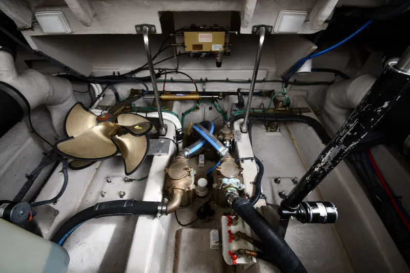 Slide: The Image of Engine room of a 2004 Sea Ray 420 Sundancer with visible propeller and mechanical components. - 51