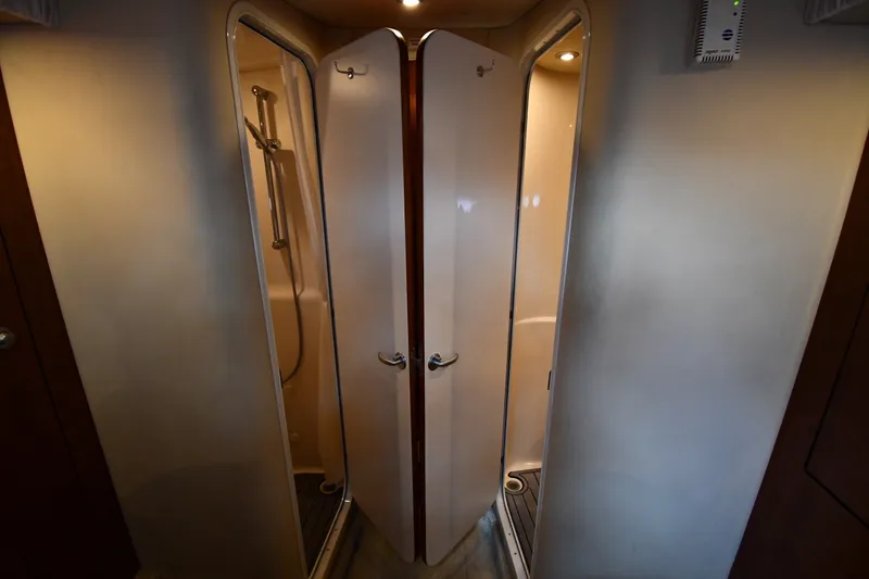 Slide: The Image of Interior view of 2004 Sea Ray 420 Sundancer shower area with dual doors. - 31