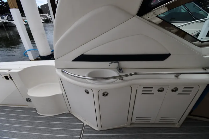 Slide: The Image of 2004 Sea Ray 420 Sundancer yacht interior with sink and storage cabinets. - 17