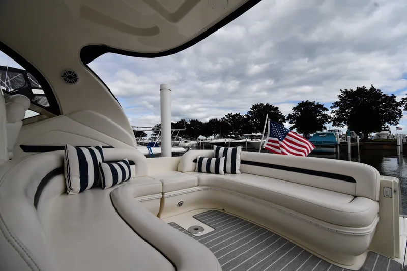 Slide: The Image of Luxurious 2004 Sea Ray 420 Sundancer yacht interior with striped cushions and American flag. - 21
