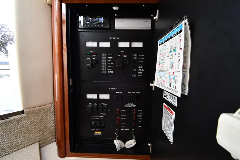 Slide: The Image of Electrical control panel inside a 2004 Sea Ray 420 Sundancer yacht. - 47