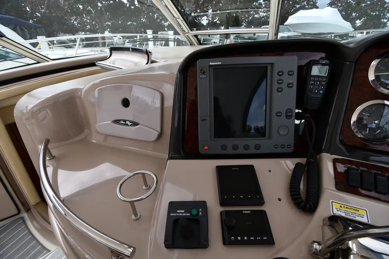 Slide: The Image of Control panel of a 2004 Sea Ray 420 Sundancer yacht with navigation equipment. - 11