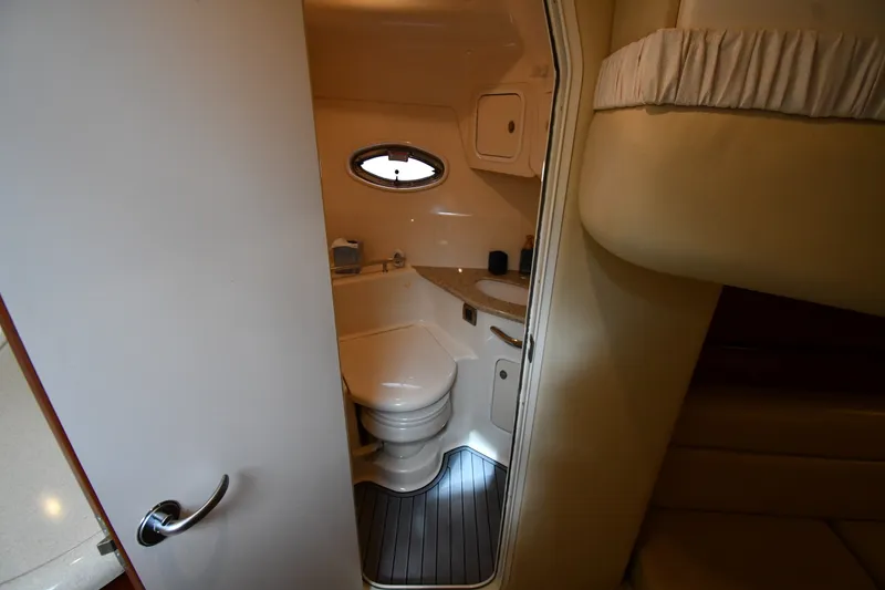 Slide: The Image of Interior view of 2004 Sea Ray 420 Sundancer yacht bathroom with compact design. - 45