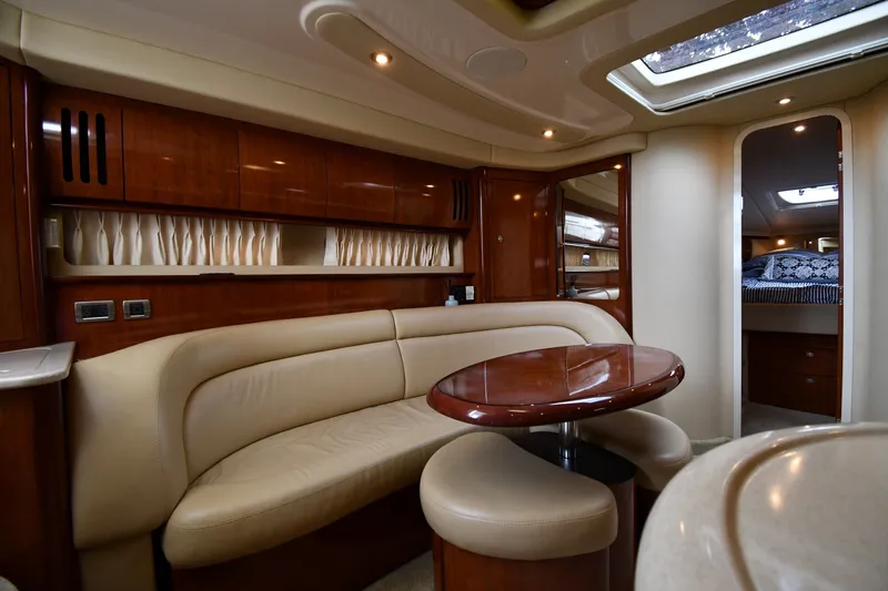 Slide: The Image of Luxurious interior of a 2004 Sea Ray 420 Sundancer yacht with elegant seating and wood finishes. - 35
