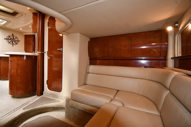 Slide: The Image of Luxurious interior of 2004 Sea Ray 420 Sundancer yacht with leather seating and wooden cabinetry. - 43