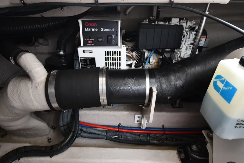 Slide: The Image of Engine room of 2004 Sea Ray 420 Sundancer with Onan marine generator and Cummins components. - 52