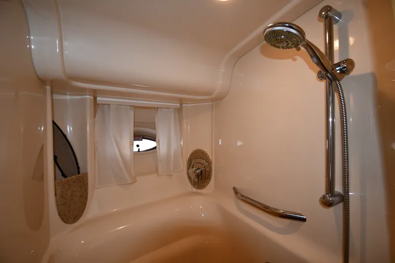 Slide: The Image of Luxurious bathroom in 2004 Sea Ray 420 Sundancer yacht with shower and porthole window. - 33