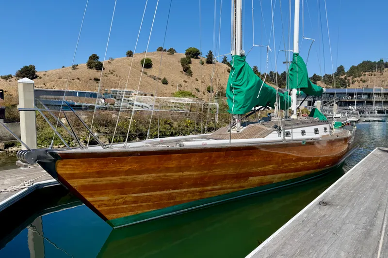 Slide: The Image of Custom 49 Schooner by Chuck Burns, 2007, docked with green sail covers. - 6