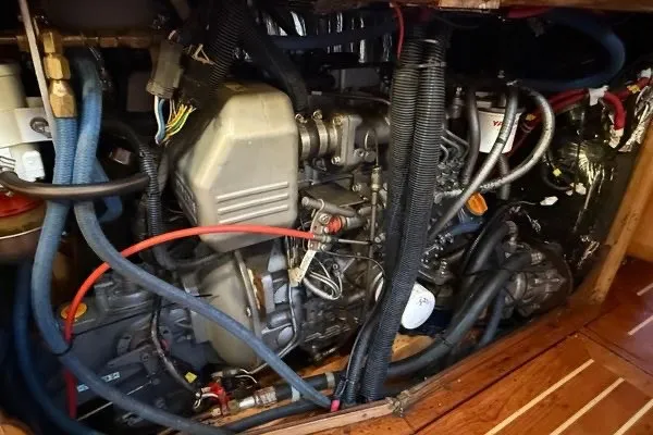 Slide: The Image of Engine compartment of a 2007 Chuck Burns Custom 49 Schooner, showcasing intricate wiring and components. - 14