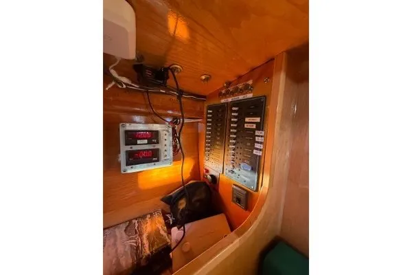 Slide: The Image of Electrical panel inside 2007 Chuck Burns Custom 49 Schooner, featuring control switches and wiring. - 12
