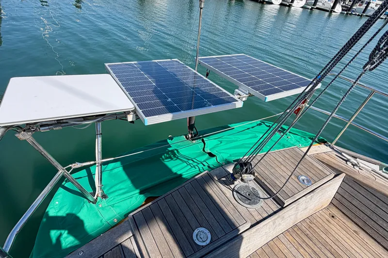 Slide: The Image of Solar panels on a 2007 Chuck Burns Custom 49 Schooner, docked at a marina. - 27