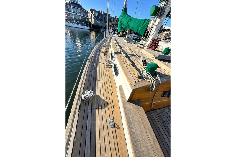 Slide: The Image of 2007 Chuck Burns Custom 49 Schooner with wooden deck, docked in marina. - 8