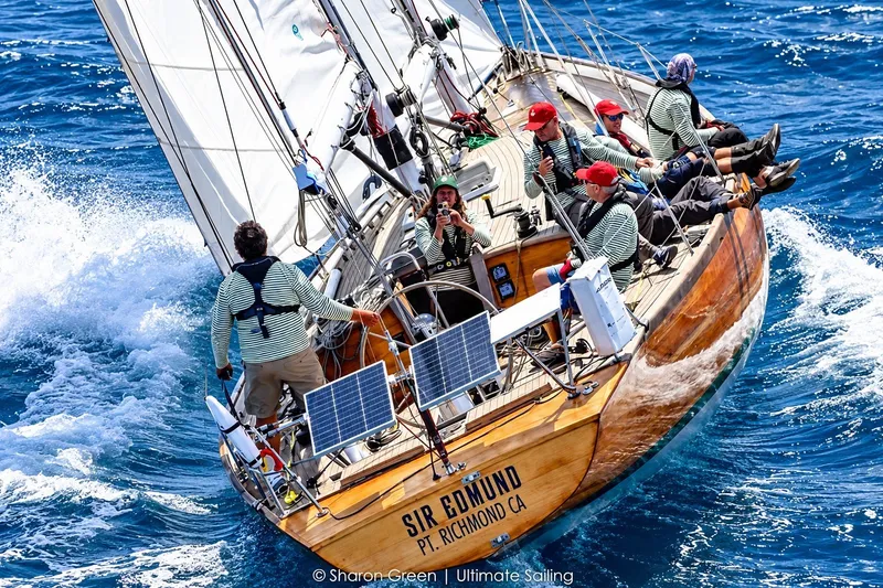 Slide: The Image of Sailing crew on Chuck Burns Custom 49 Schooner, 2007, navigating vibrant blue ocean waters. - 0