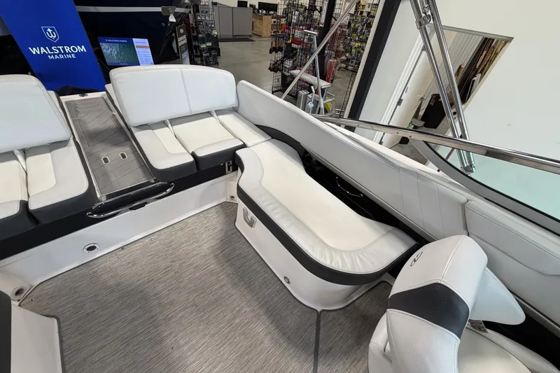 Slide: The Image of 2015 Regal 2300 Bowrider interior with white seating and modern design. - 19