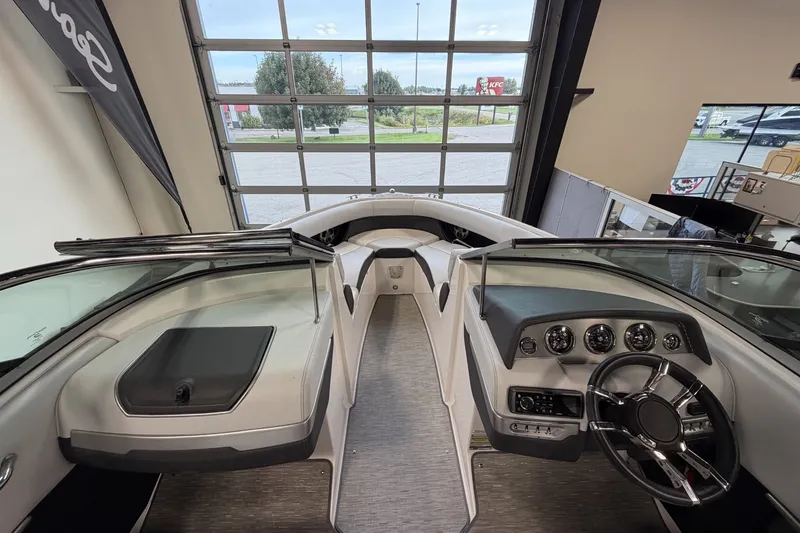 Slide: The Image of 2015 Regal 2300 Bowrider interior with sleek dashboard and spacious seating. - 20
