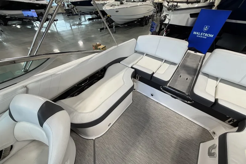 Slide: The Image of 2015 Regal 2300 Bowrider interior with white seating and modern design. - 18