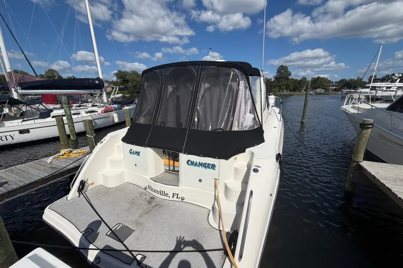 Slide: The Image of 1997 Maxum 4100 SCR boat docked in Niceville, FL under a clear blue sky. - 1