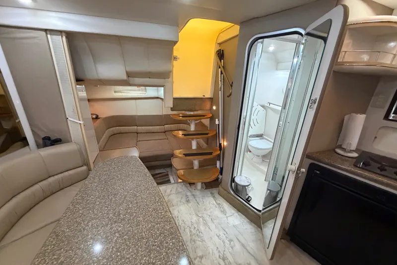 Slide: The Image of Luxurious interior of 1997 Maxum 4100 SCR yacht with modern amenities and elegant design. - 17
